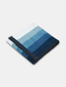 Blue ombre striped cotton hand towel with a soft terry finish