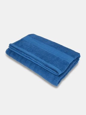 Folded royal blue cotton bath towel