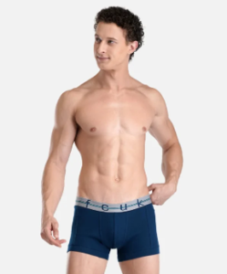Man wearing solid navy trunks